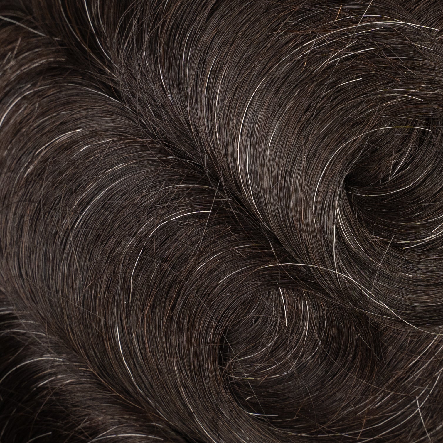 A close-up image of a Poly Hair System (Medium Density) for natural-looking hair restoration solutions