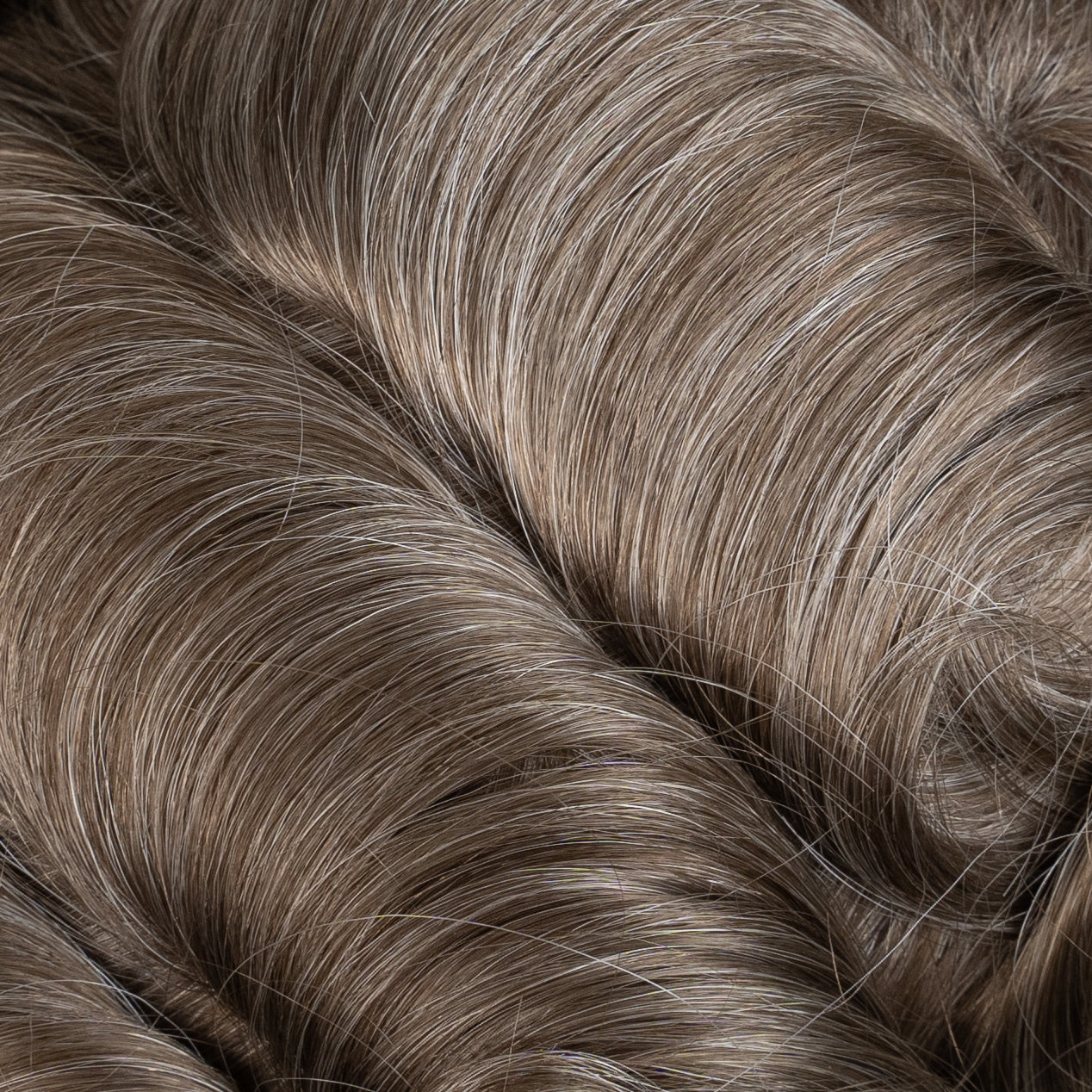 Close-up image of a Poly Hair System with medium density, perfect for natural-looking hair enhancement and coverage