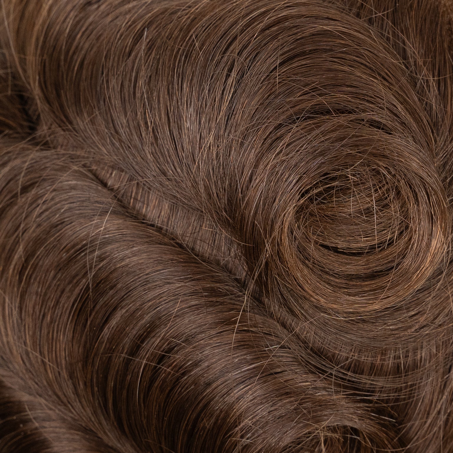 Close-up image of a medium density poly hair system for natural-looking hair restoration