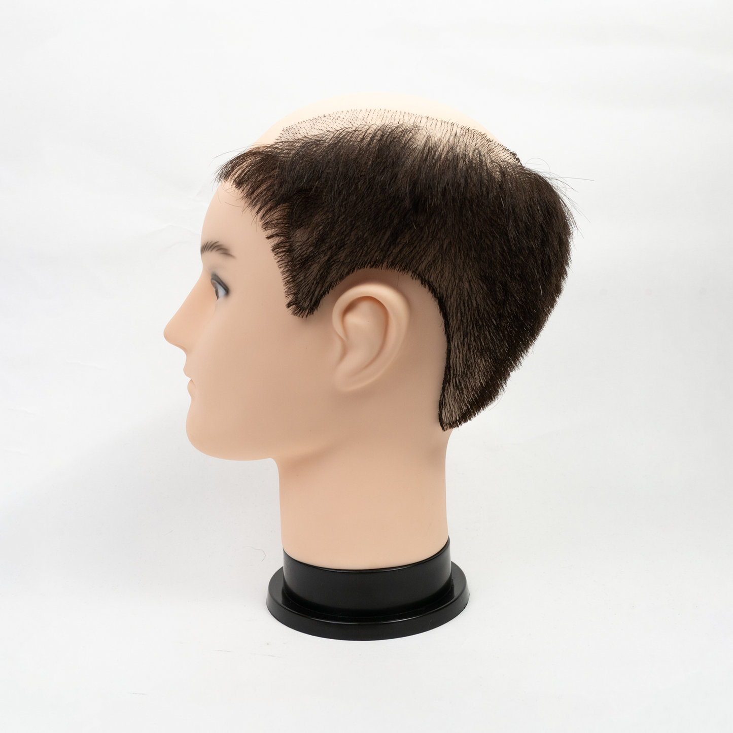 Female mannequin head with long blonde hair and blue eyes