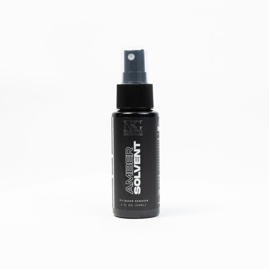 NSG Amber Solvent, a high-quality cleaning solution for industrial use, in a transparent bottle with a yellow label